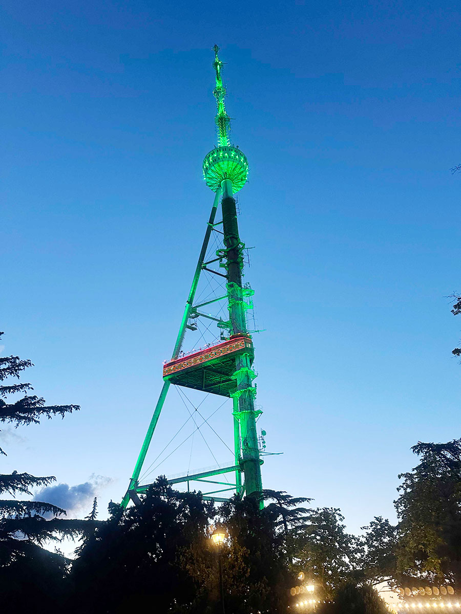 Tbilisi Tower is lit up with the colors of the Flag of Turkmenistan